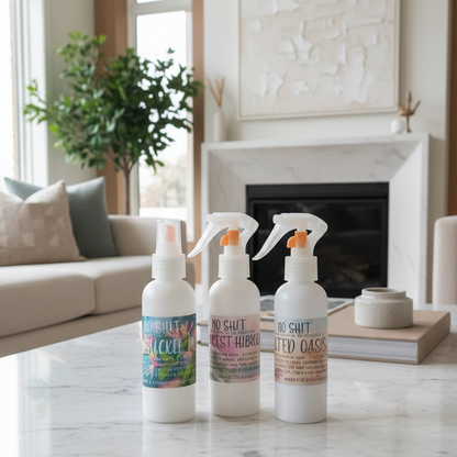 Three bottles of cleaning products on a marble coffee table in a living room.